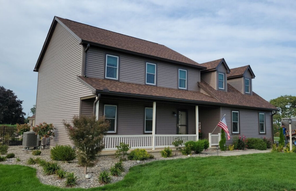 Exterior view of a home with siding installed by Zimmerman's Roofing