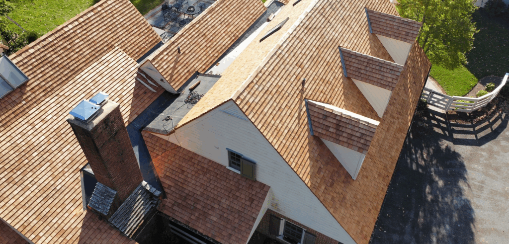 Aerial view of residential roofing project with architectural shingles