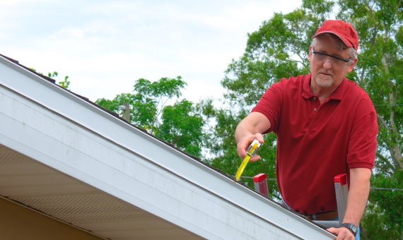 ZImmerman's Roofing employee working on a roof