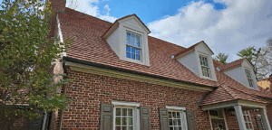 Residential shingle roof replacement on a brick exterior home