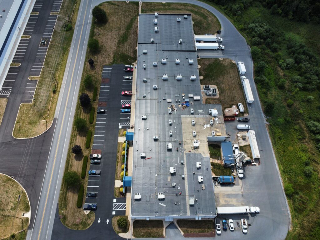 Aerial view of a commercial flat roof installed by Zimmerman's Roofing